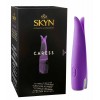 Чорна упаковка SKYN Caress із золотистими та рожевими елементами, логотип SKYN, напис Caress